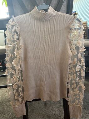 Brand new beige top with floral see-through sleeves! Size L